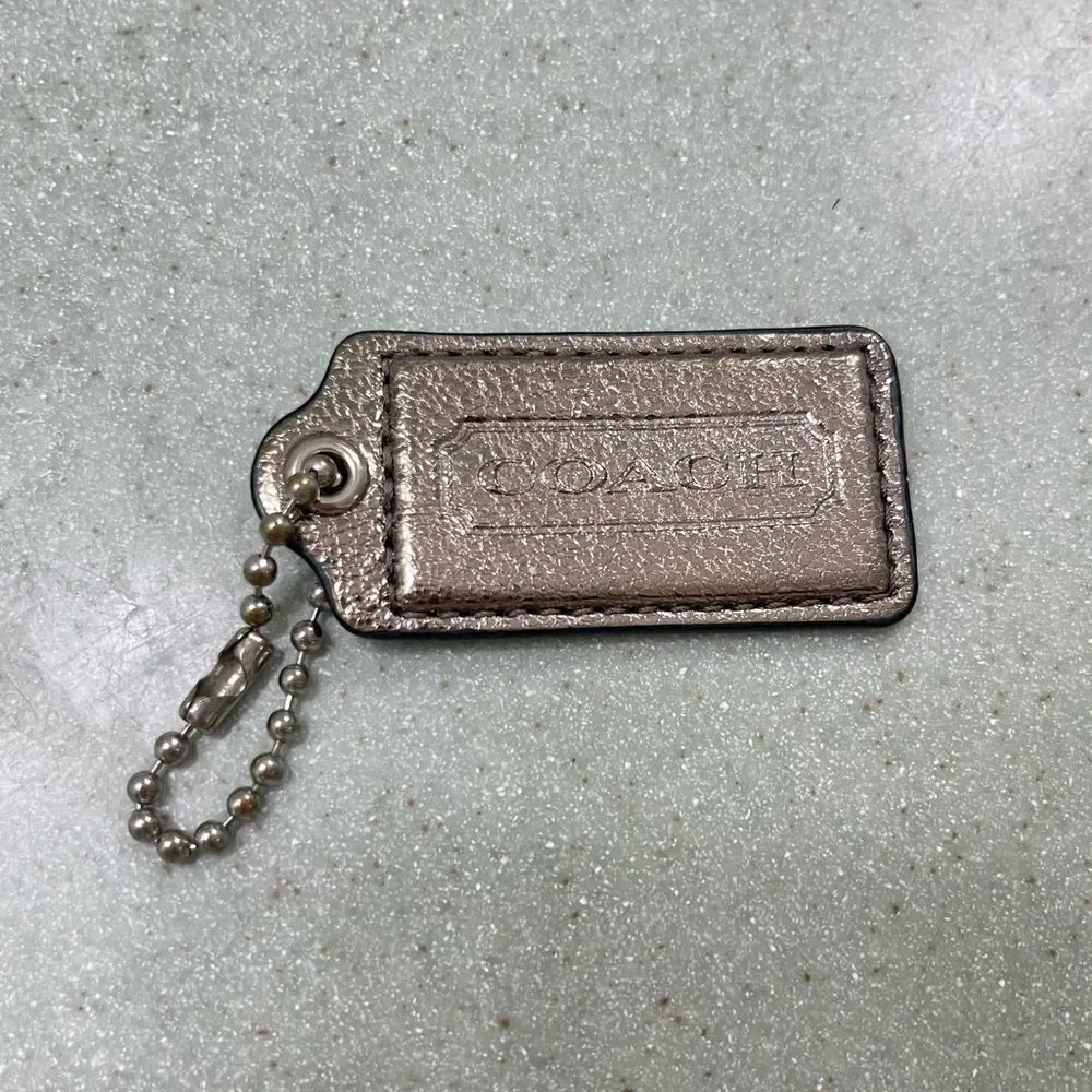 Metallic silver - Coach Stamped Leather Hang Tag